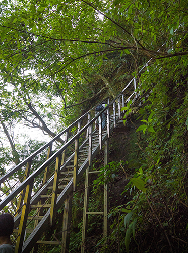 Metal staircase on the way to Pipa Cave Waterfall