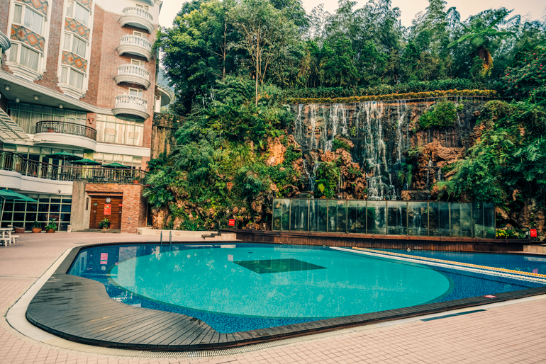 Outdoor pool and man-made waterfall