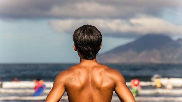 Surfer dude at Wai'ao Beach in Yilan