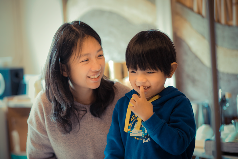 The owner of the tea shop with her son