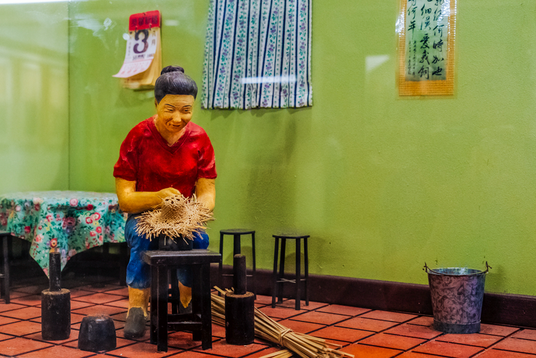 Diorama showing weaving woman